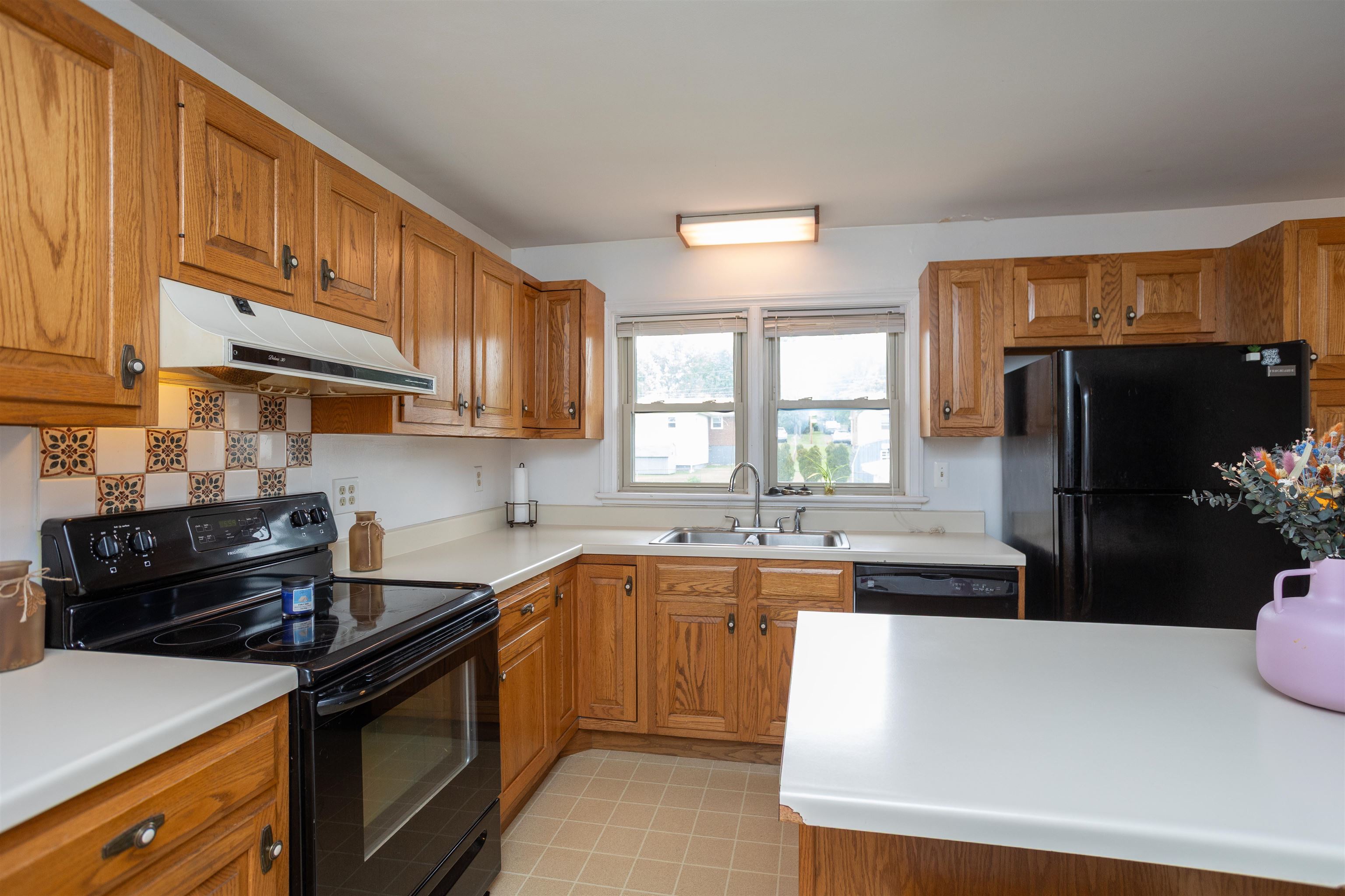211 George Street Staunton, VA 24401 - Photo 10 of 37 a kitchen with a sink a stove and refrigerator