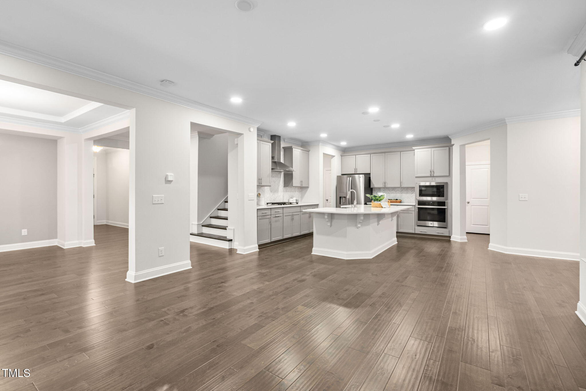 705 Blue Pointe Path Apex, NC 27523 - Photo 15 of 39 a view of kitchen with wooden floor