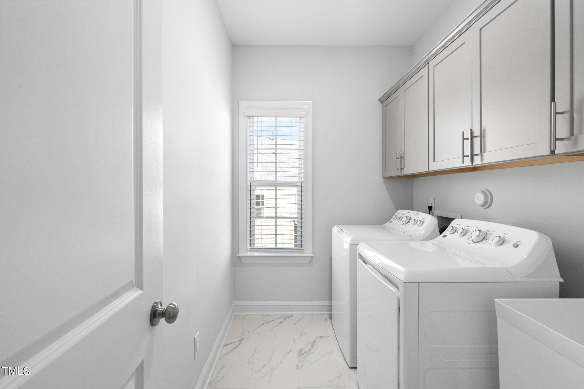 705 Blue Pointe Path Apex, NC 27523 - Photo 34 of 39 a view of utility room with washer and dryer