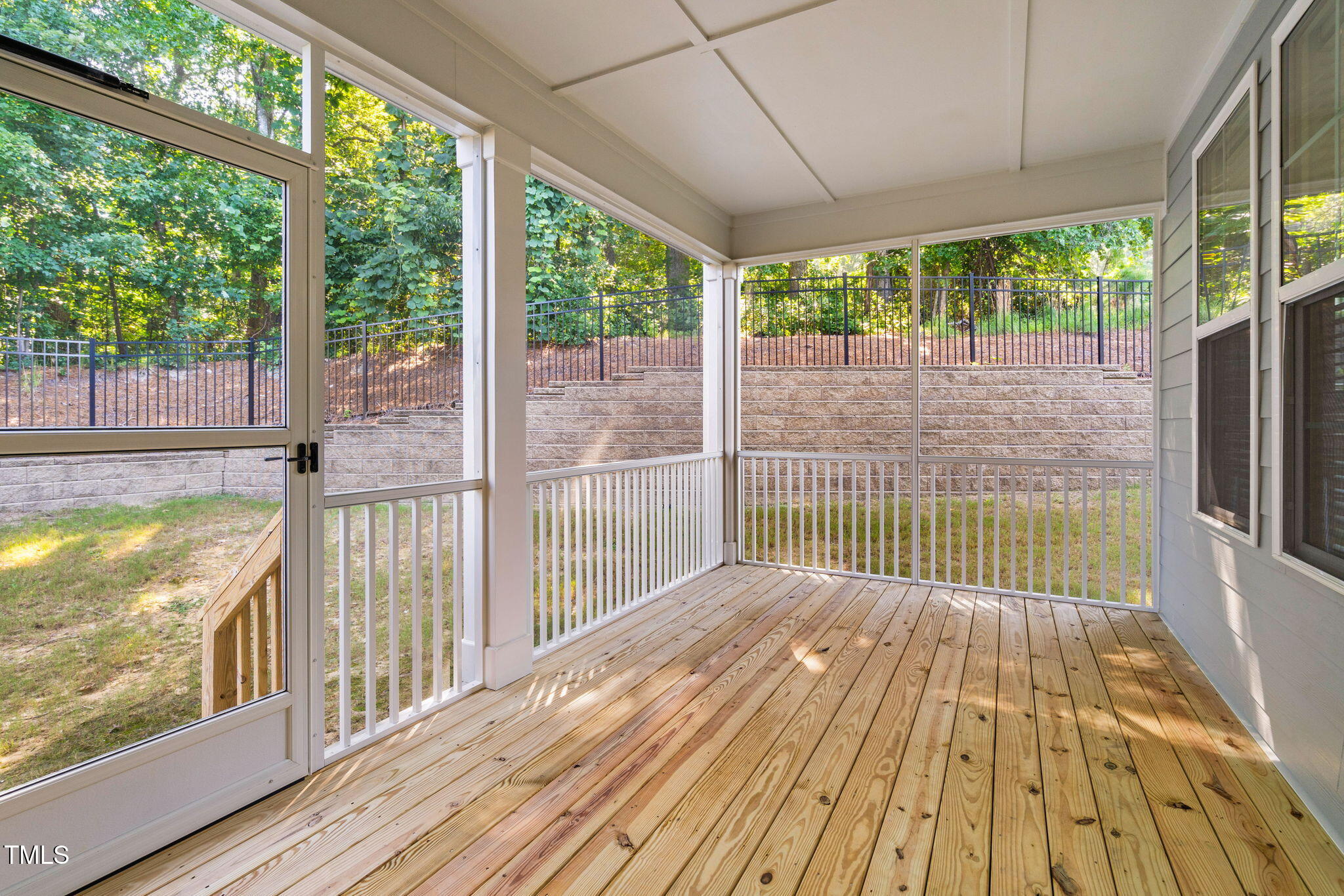 705 Blue Pointe Path Apex, NC 27523 - Photo 35 of 39 a view of porch with wooden floor and floor