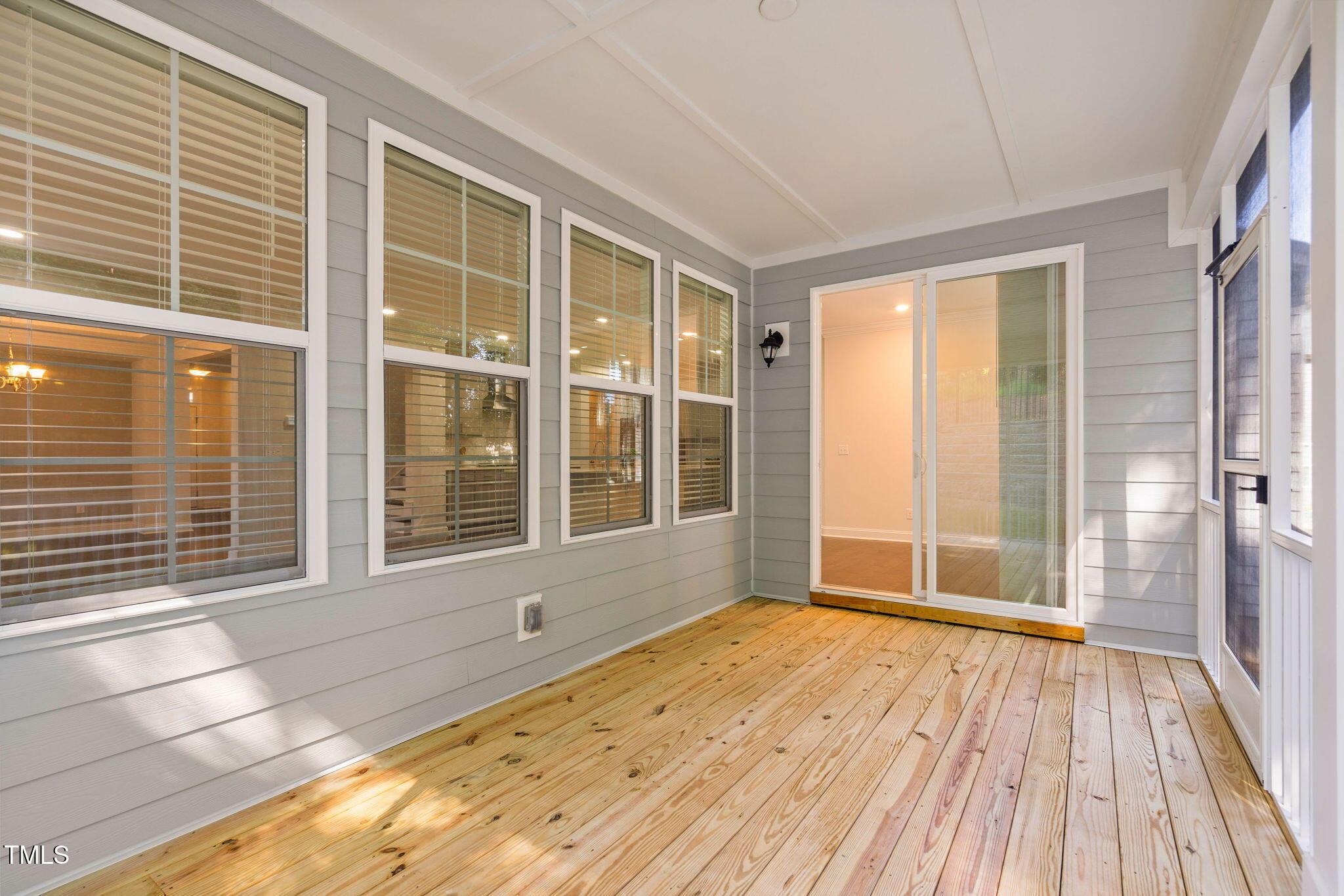 705 Blue Pointe Path Apex, NC 27523 - Photo 36 of 39 a view of an empty room with wooden floor and a window