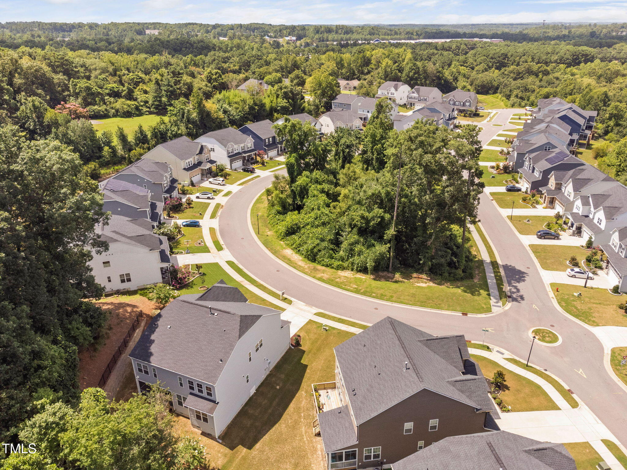 705 Blue Pointe Path Apex, NC 27523 - Photo 5 of 39 an aerial view of a house with a swimming pool