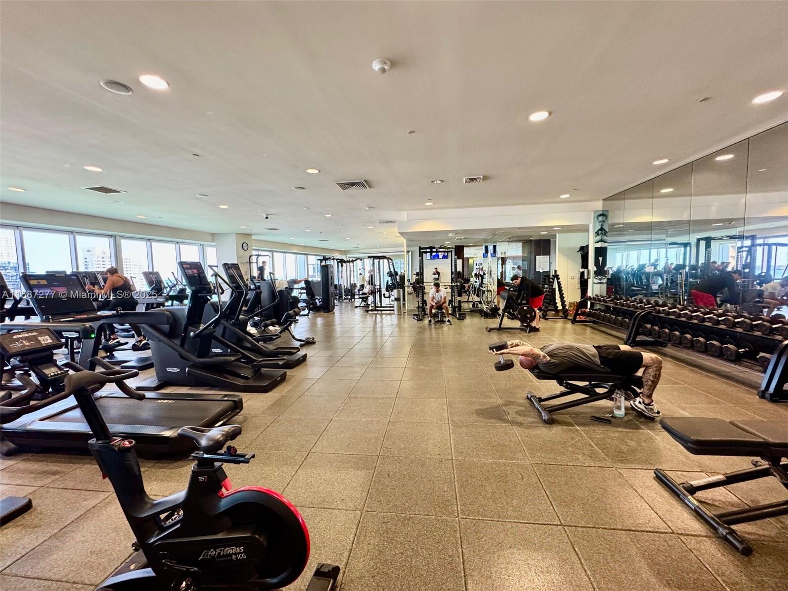 Brickell Miami, FL 33131 - Photo 12 of 15 a living room with lots of gym equipment