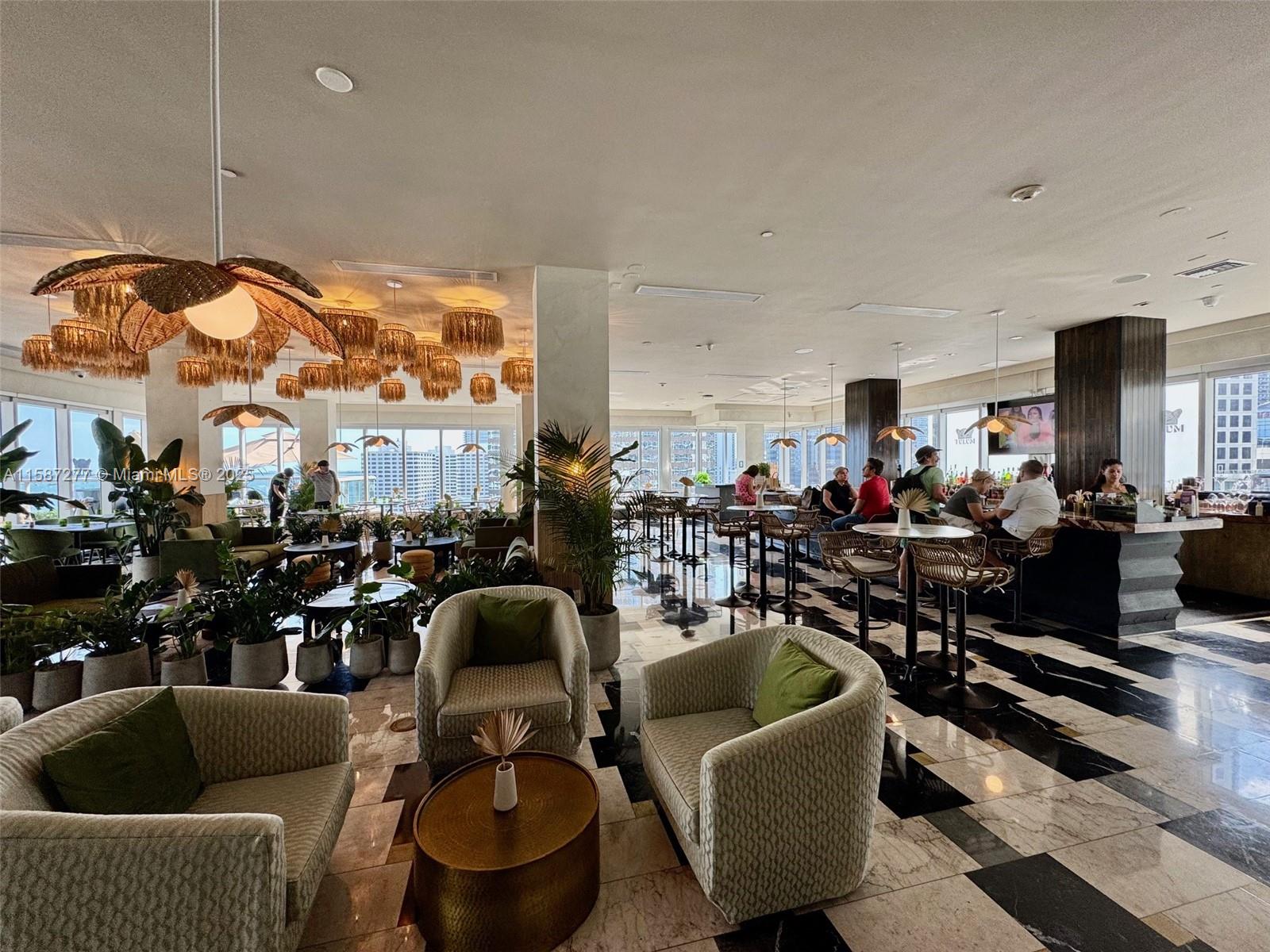 Brickell Miami, FL 33131 - Photo 13 of 15 a living room with lots of furniture and a large window