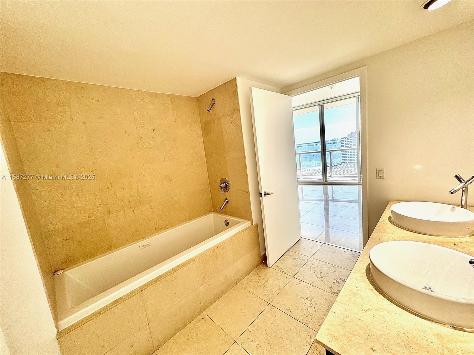 Brickell Miami, FL 33131 - Photo 5 of 15 a bathroom with a bathtub and sink