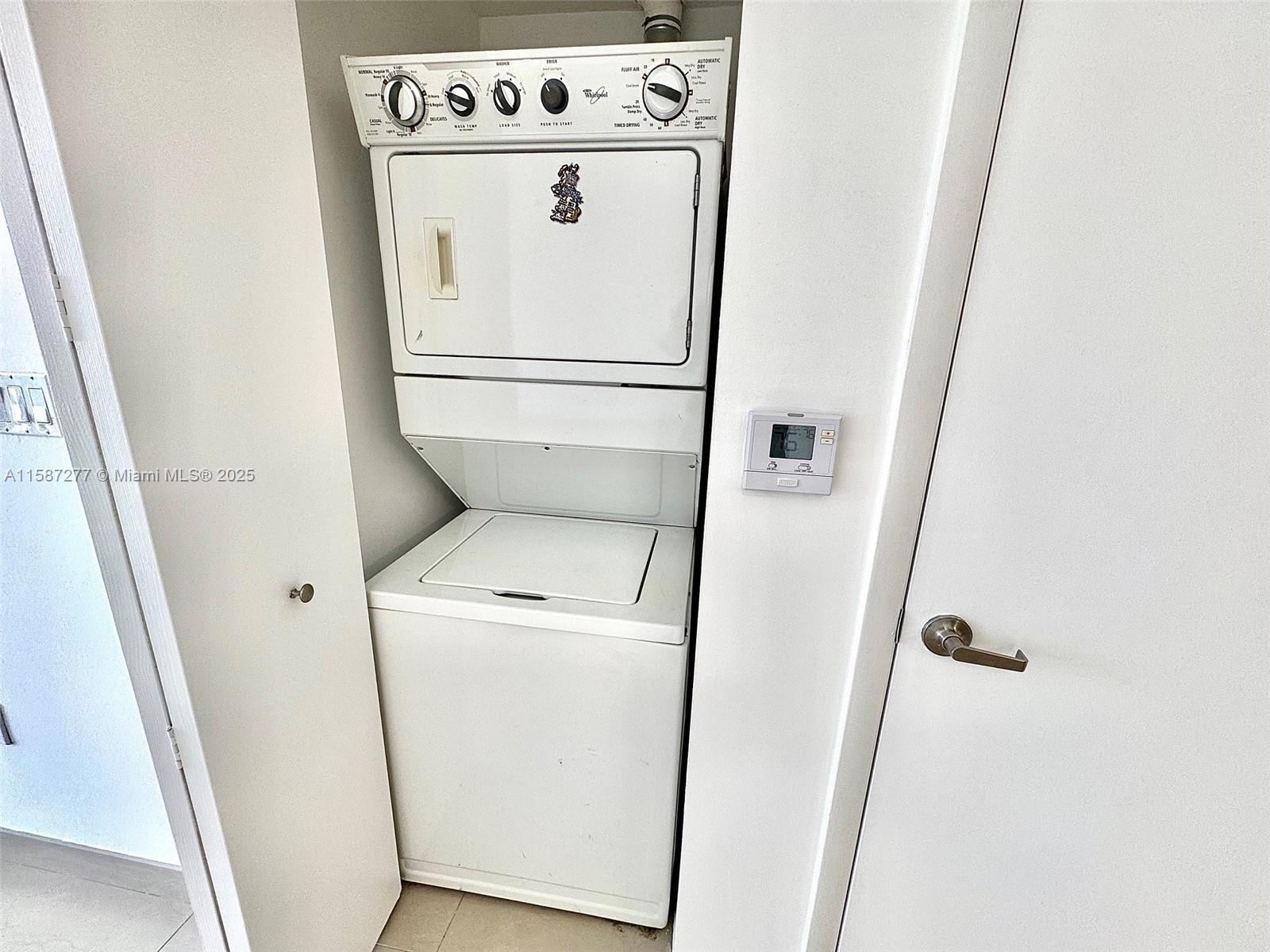 Brickell Miami, FL 33131 - Photo 10 of 15 a utility room with dryer and washer