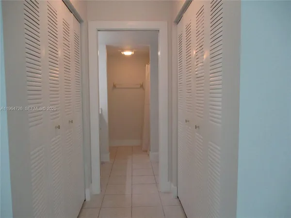 a view of a bathroom from a hallway