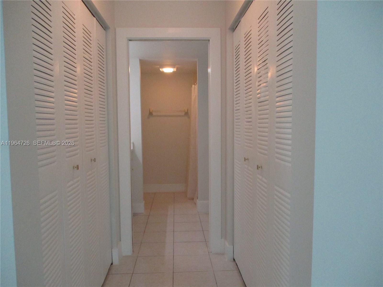 6531 Southeast Federal Highway, Unit F107 Stuart, FL 34997 - Photo 13 of 38 THE HALLWAY WITH TWO CLOSETS