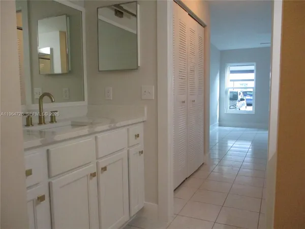 a bathroom with a sink and mirror