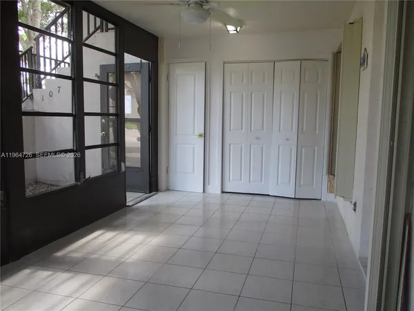 a view of an empty room with a window