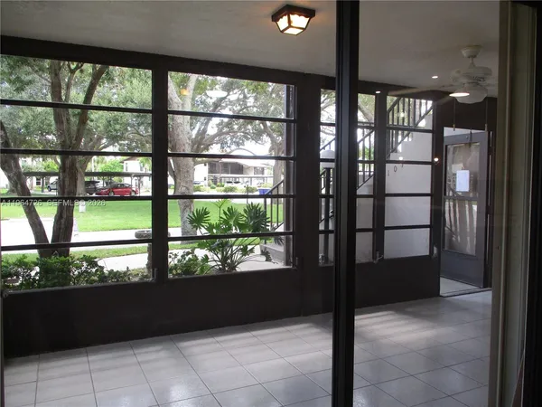 a view of a living room that has a large window