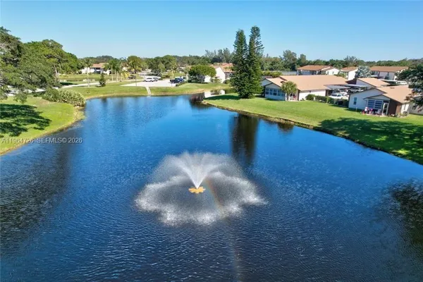 a view of a lake with a yard