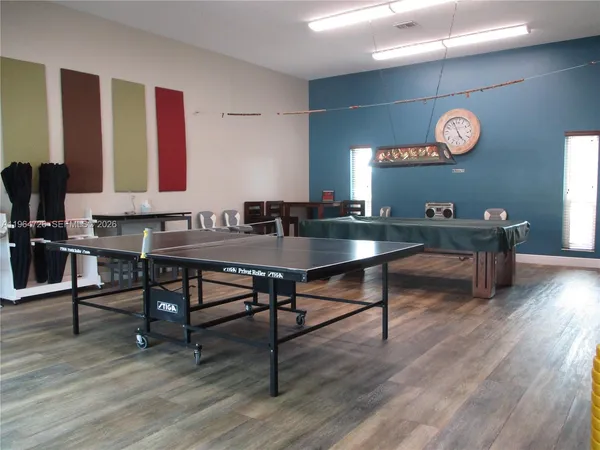 a workspace with furniture and wooden floor