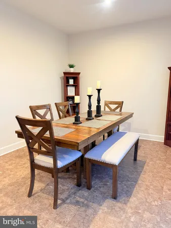 a room with a table and chairs