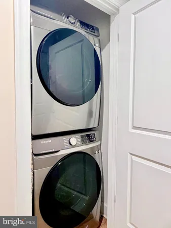 a bedroom with a bed and lamps