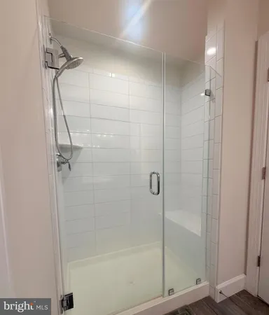 a bathroom with a sink vanity and mirror