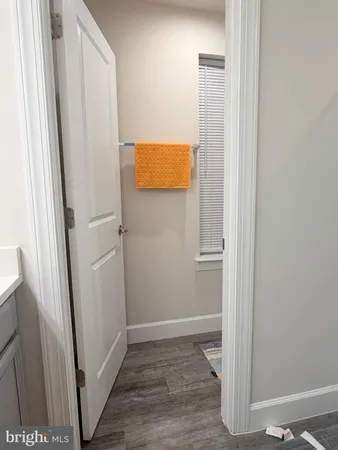 a white toilet sitting next to a sink