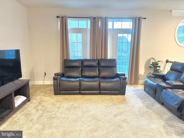 a living room with a couch and a flat screen tv