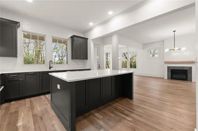 a kitchen with stainless steel appliances a refrigerator and a sink