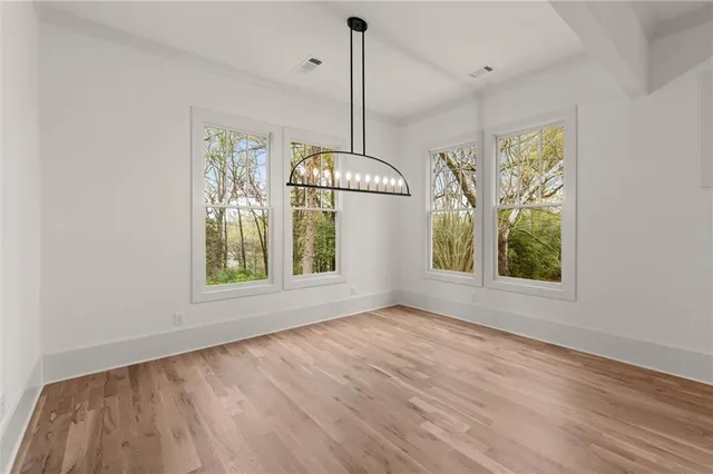 a view of a kitchen with a sink and refrigerator