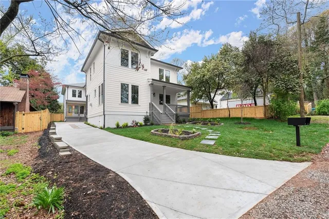 a front view of a house with garden