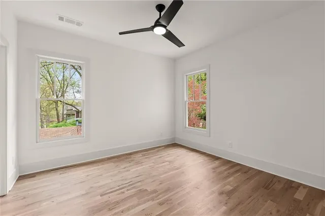 a view of a room with wooden floor