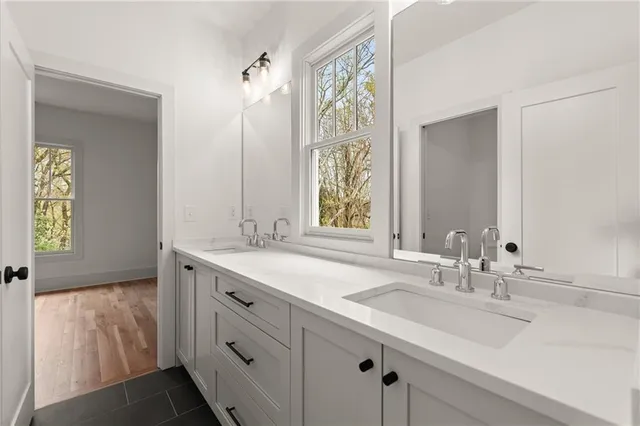 a bathroom with a bathtub and shower