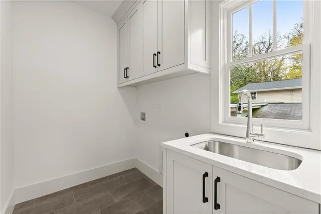 a view of house with deck and trees