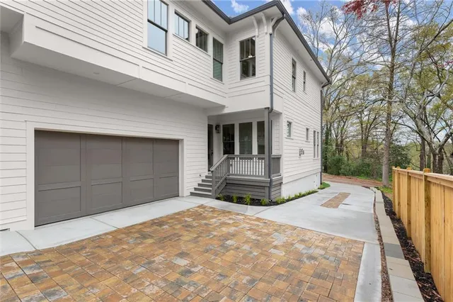 a front view of a house with a garage