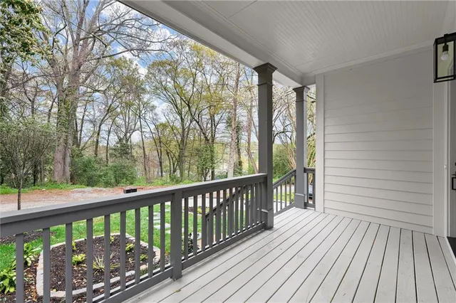 a view of a two chairs in the balcony