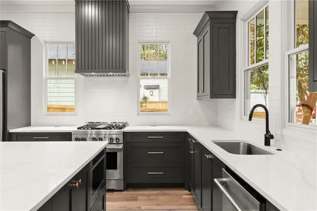 a kitchen with a stove and a sink