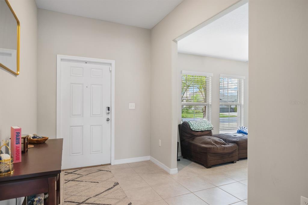 16640 Carlton Pond Street Wimauma, FL 33598 - Photo 3 of 32 a living room with furniture and a window