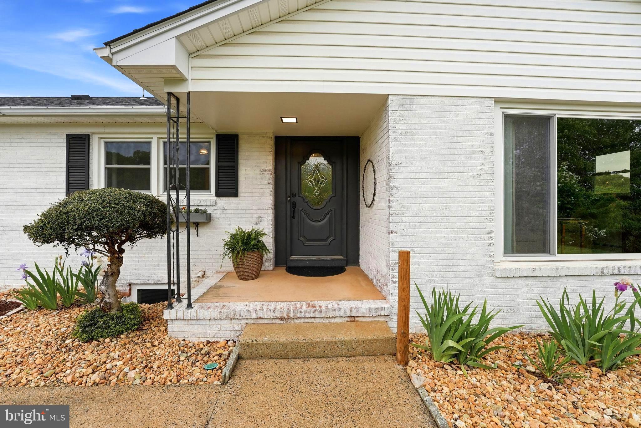 481 James City Road Leon, VA 22725 - Photo 61 of 88 a front view of a house with potted plants