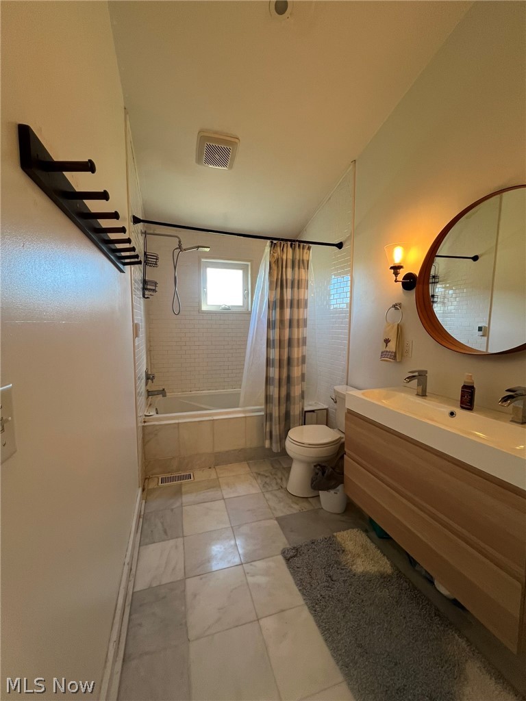 15393 Shade Road Guysville, OH 45735 - Photo 15 of 35 Bathroom with a wood-finish vanity featuring dual integrated sinks and polished chrome fixtures