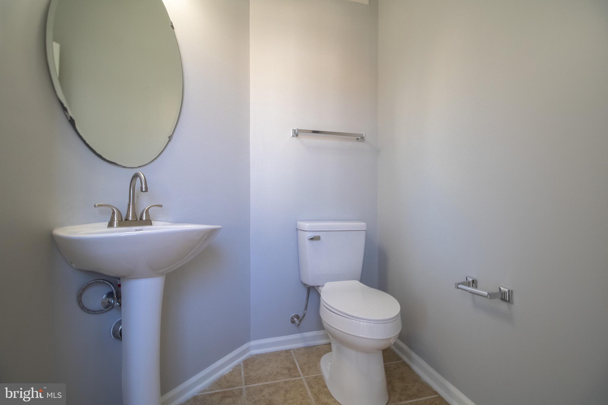 98 Lullwater Way Falling Waters, WV 25419 - Photo 18 of 43 a bathroom with a toilet sink and mirror