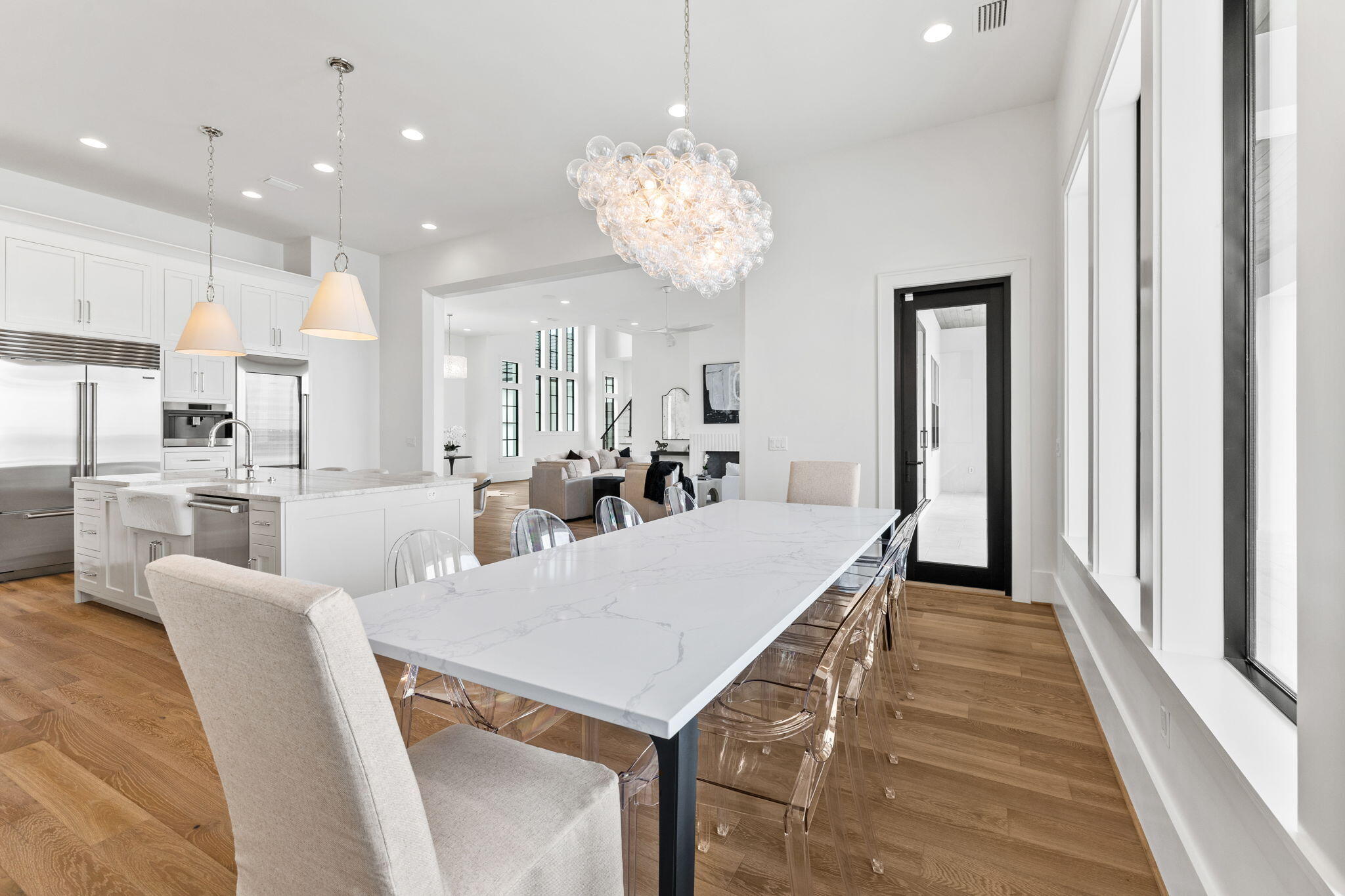 480 Captains Circle Destin, FL 32541 - Photo 15 of 63 a view of a dining room with furniture and wooden floor