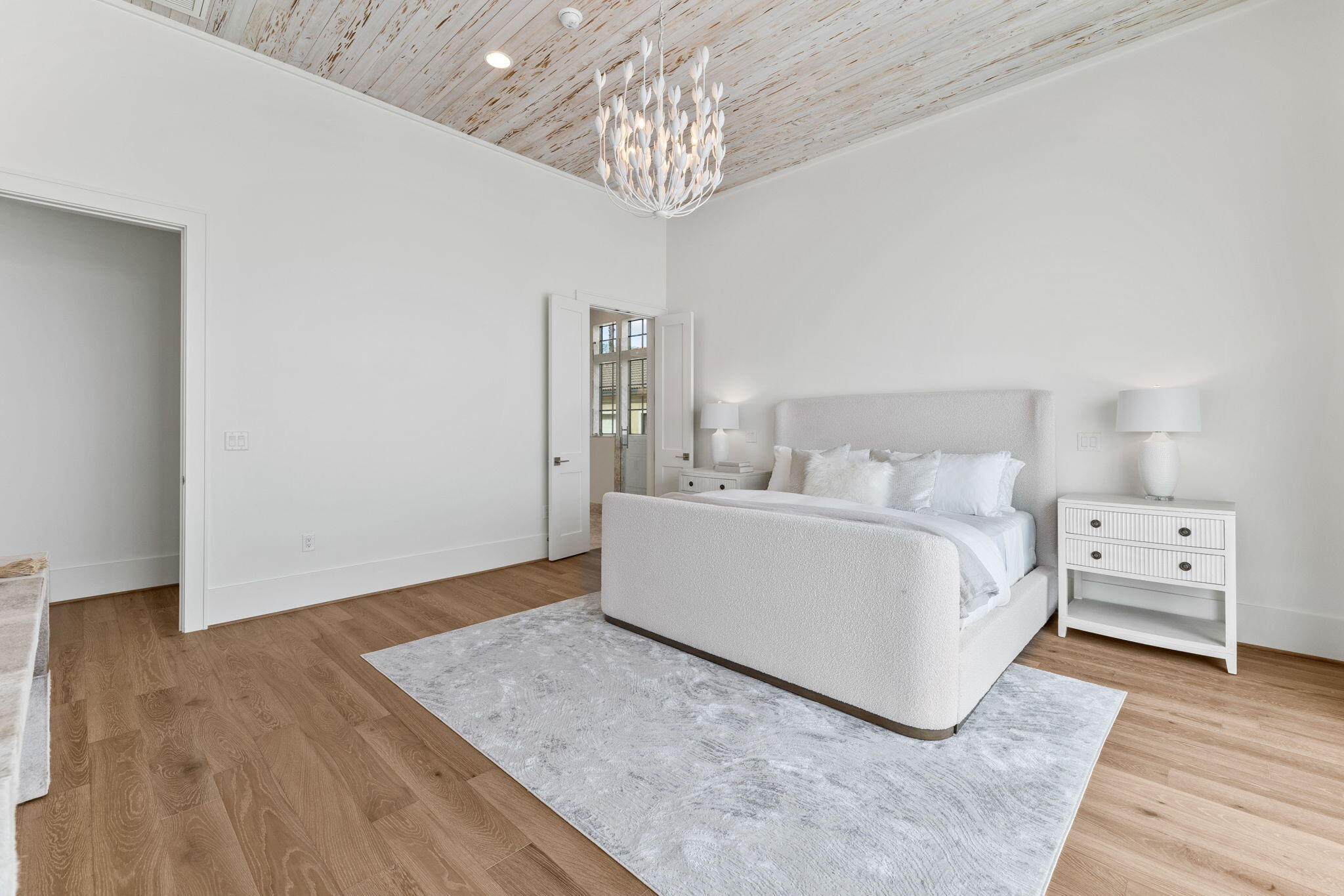 480 Captains Circle Destin, FL 32541 - Photo 18 of 63 a room with a bed and a chandelier