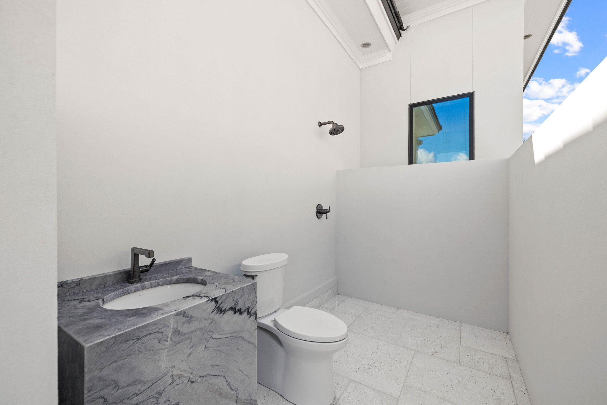 480 Captains Circle Destin, FL 32541 - Photo 22 of 63 a white toilet sitting next to a bathroom sink