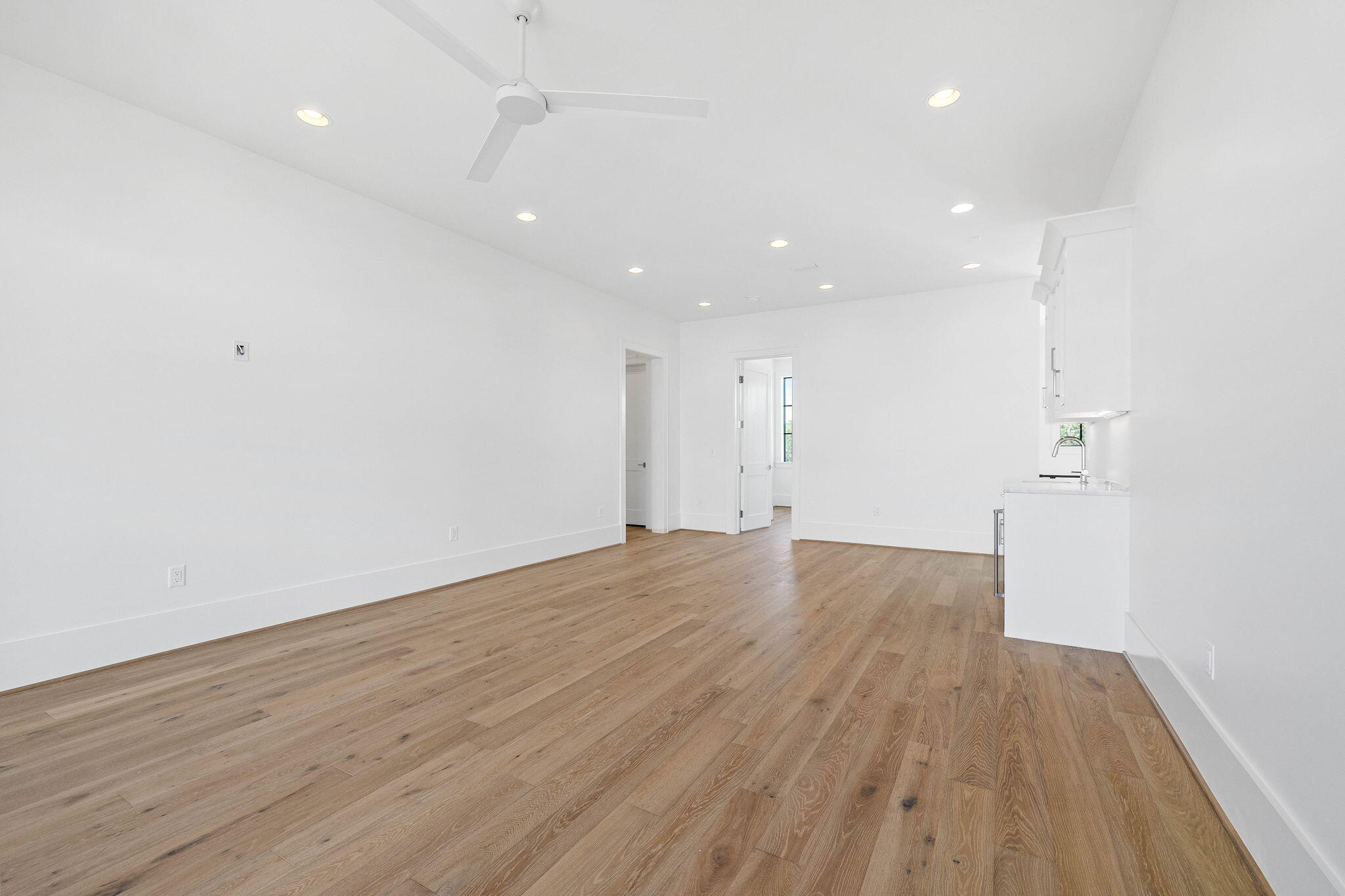 480 Captains Circle Destin, FL 32541 - Photo 37 of 63 a view of empty room with wooden floor and fan