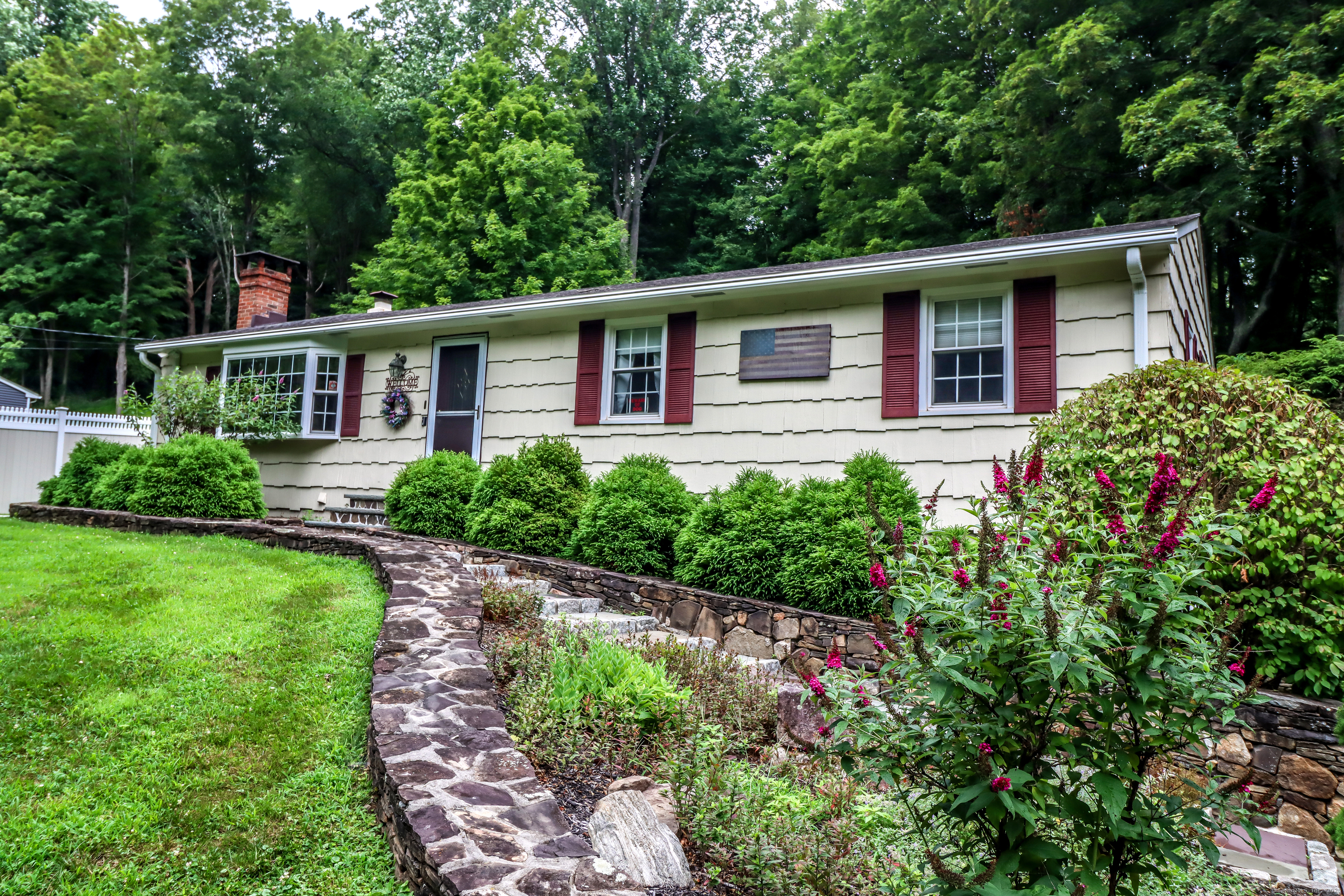 front view of a house with a yard