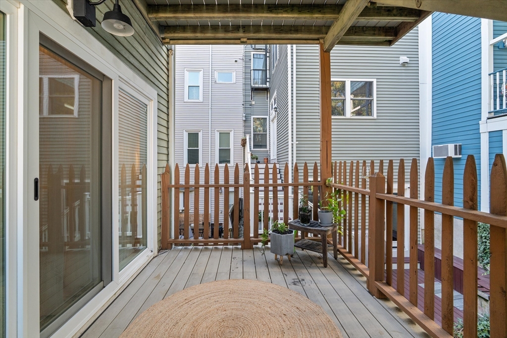 402 East 7th Street, Unit 2 Boston, MA 02127 - Photo 12 of 19 a view of backyard with a deck and furniture