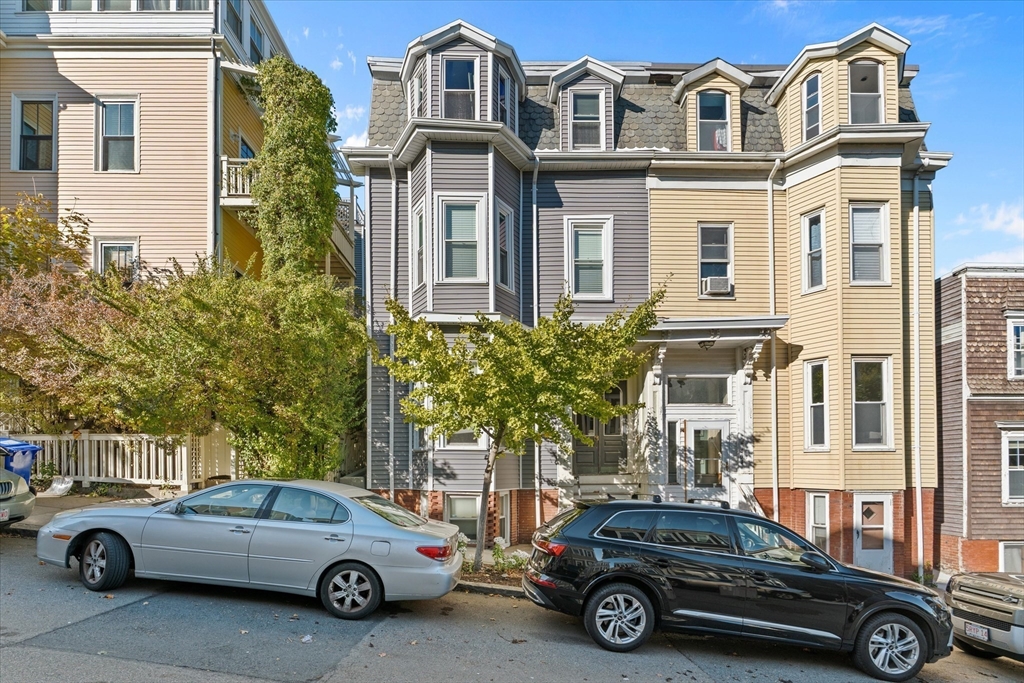 402 East 7th Street, Unit 2 Boston, MA 02127 - Photo 14 of 19 a car parked in front of a house