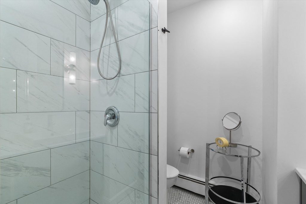 402 East 7th Street, Unit 2 Boston, MA 02127 - Photo 17 of 19 a bathroom with a shower