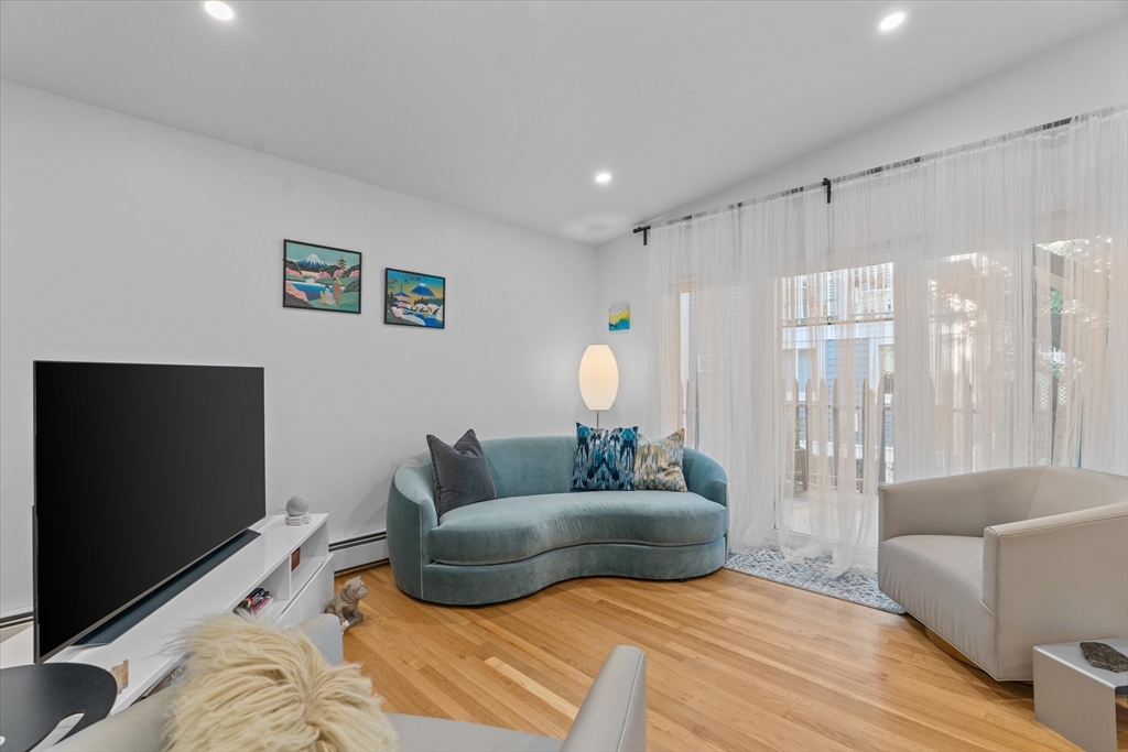 402 East 7th Street, Unit 2 Boston, MA 02127 - Photo 3 of 19 a living room with furniture and a flat screen tv