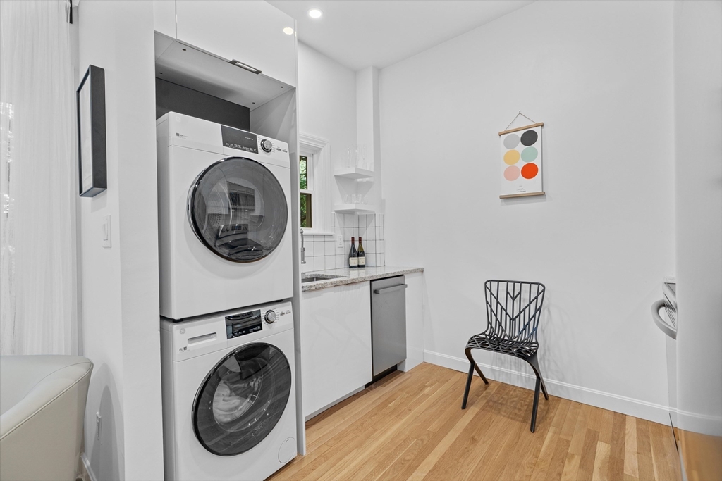 402 East 7th Street, Unit 2 Boston, MA 02127 - Photo 7 of 19 a view of a storage and utility room with washer and dryer