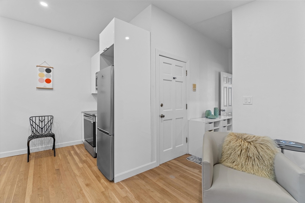 402 East 7th Street, Unit 2 Boston, MA 02127 - Photo 8 of 19 a view of a livingroom with furniture and wooden floor