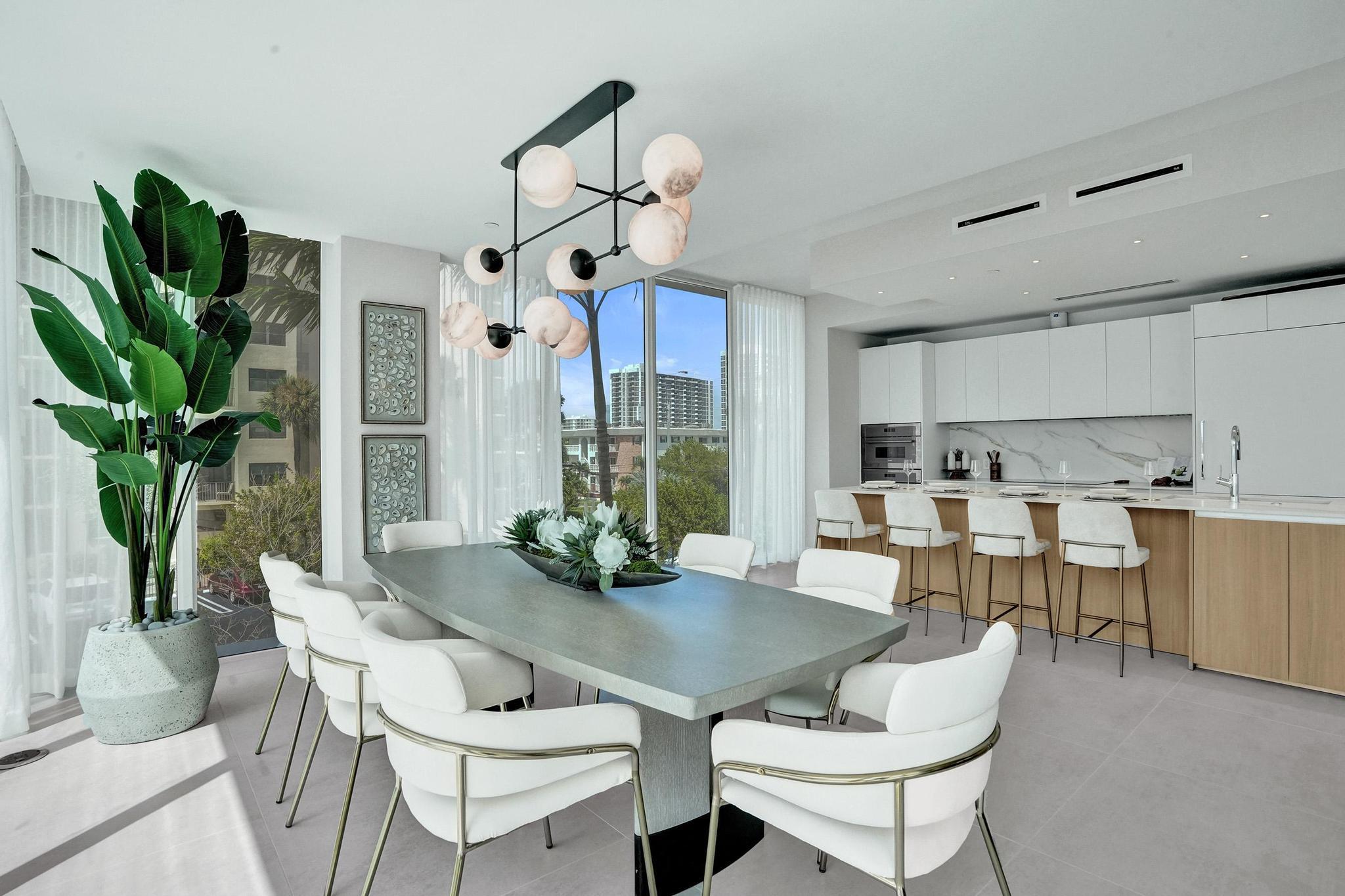 407 North Riverside Drive, Unit 203 Pompano Beach, FL 33062 - Photo 17 of 69 a view of a dining room with furniture window and wooden floor