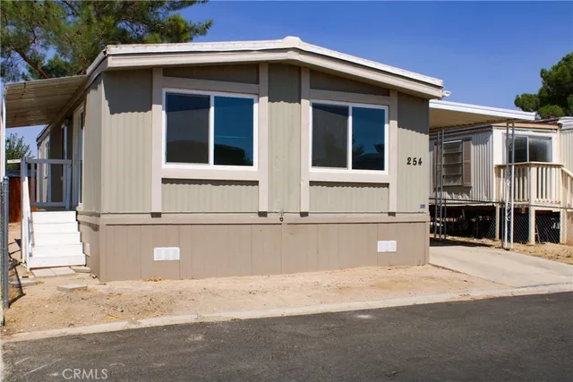 a front view of a house with large windows