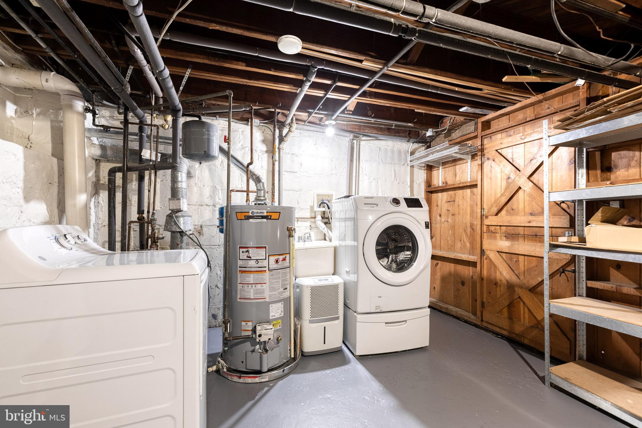 3918 Beech Avenue Baltimore, MD 21211 - Photo 23 of 24 a utility room with dryer and washer