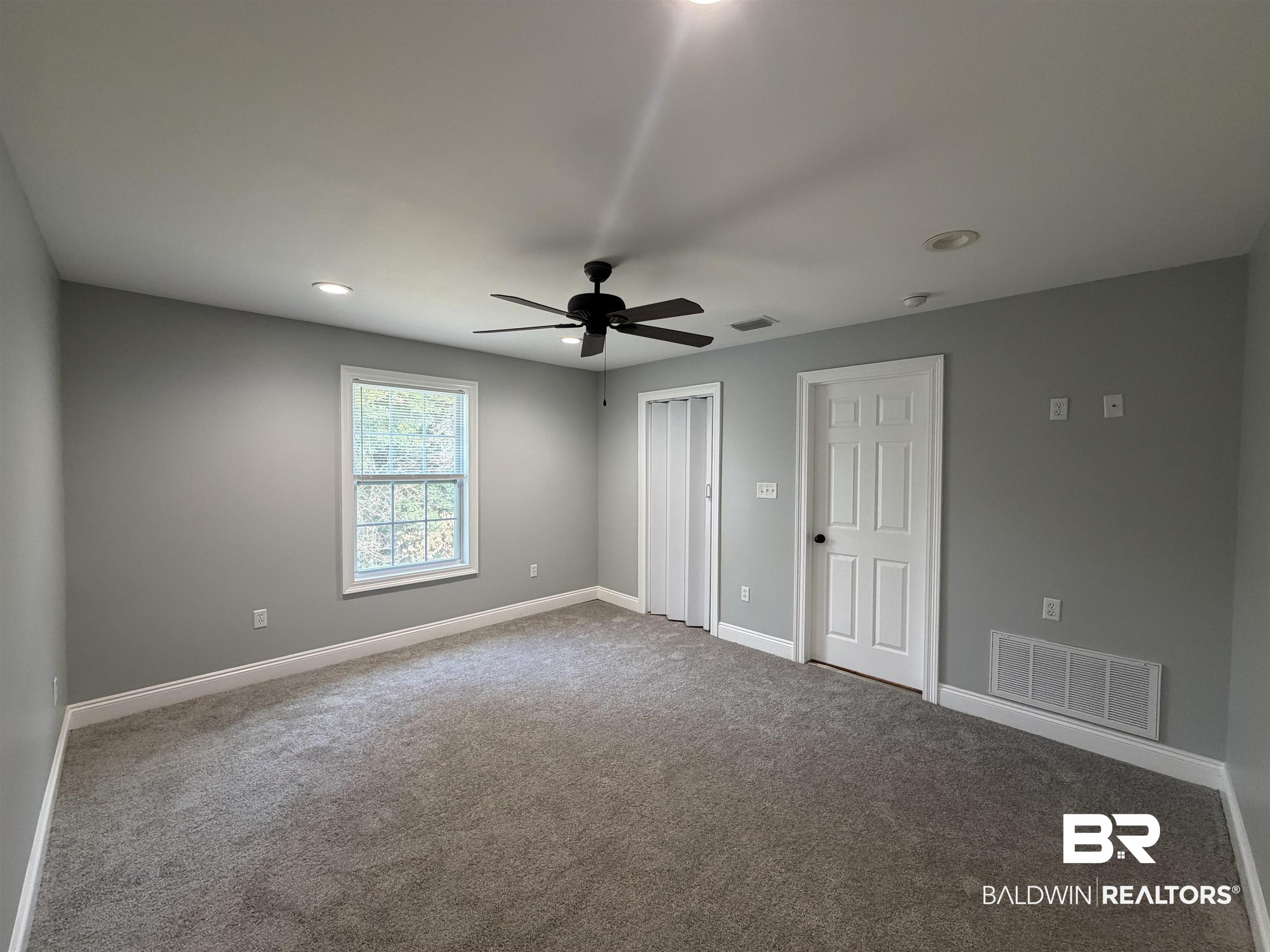 2454 Taylor Avenue Mobile, AL 36606 - Photo 21 of 24 Unfurnished bedroom with light colored carpet, a ceiling fan, recessed lighting, and a closet